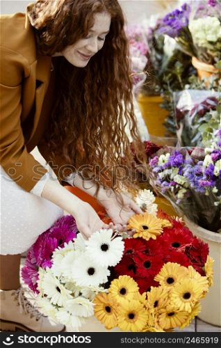 high angle woman outdoors spring with bouquet flowers