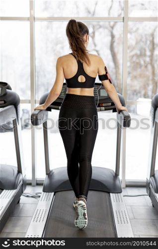 high angle woman training treadmill