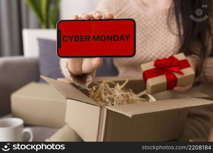 high angle woman unboxing cyber monday package