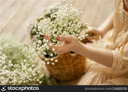 high angle woman with basket delicate spring flowers