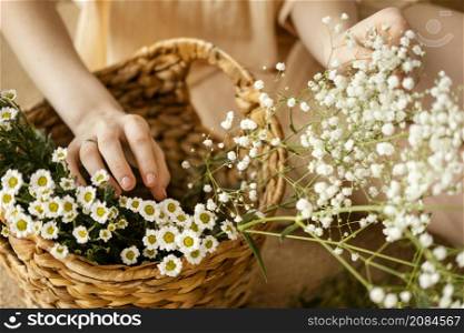 high angle woman with basket spring flowers