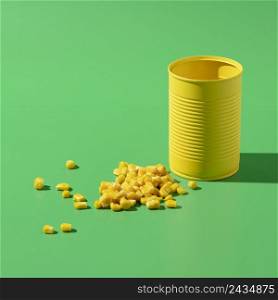 high angle yellow tall round tin can with corn