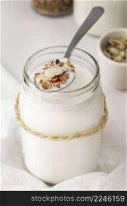 high angle yogurt jar with spoon