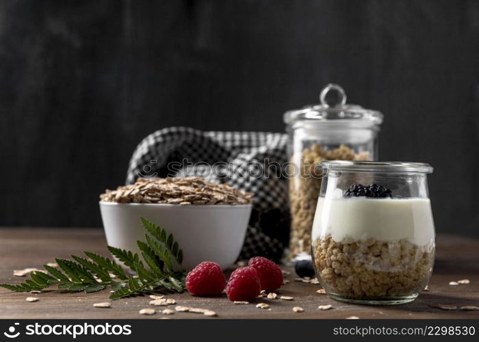 high angle yougurt with granola cereals fruits