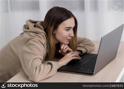 high angle young girl with laptop