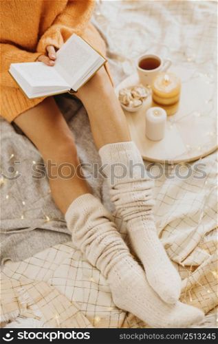 high angle young woman enjoying winter holidays with cup tea