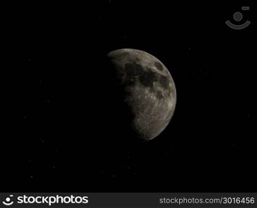 High contrast Gibbous moon with stars. High contrast Gibbous moon over dark black sky with stars seen with a telescope from northern emisphere at night