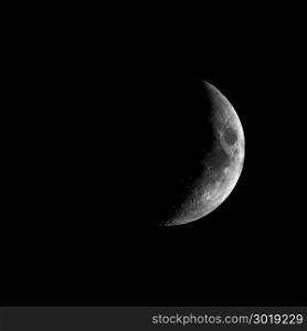 High contrast Waxing crescent moon seen with telescope. High contrast Waxing crescent moon seen with an astronomical telescope - square format in black and white