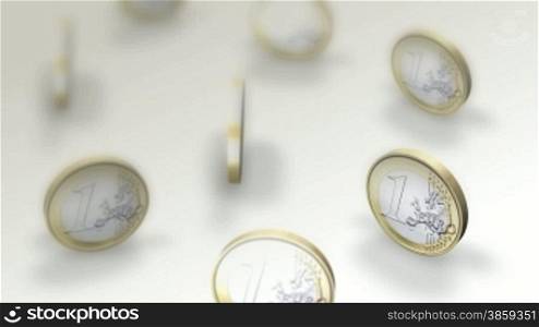 High definition animated background loop of Euro coins spinning on a white surface.