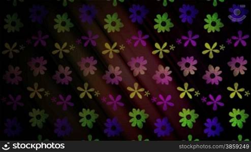 High definition animated loop of bright flower graphics moving over a dark background.