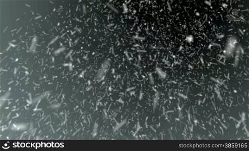 High definition animated loop of snow particles blowing ferociously on a dark, stormy, foggy background.