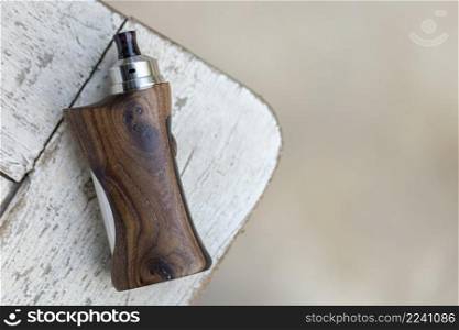 high end rebuildable dripping atomizer with stabilized natural walnut regulated box mods, vaping device, selective focus