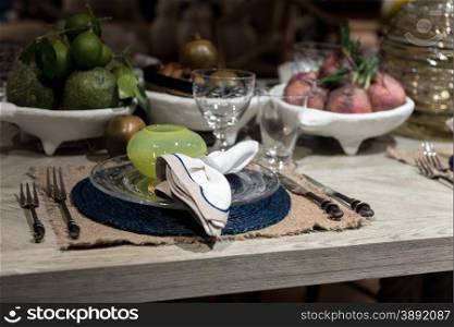 High-End Table Setting with Fine Cutlery, Glassware and Cloth Napkins