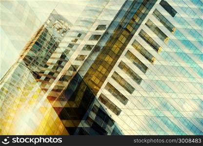 High glass modern building with blue sky and cloud at sunset for abstract background. Facades texture pattern for business background.