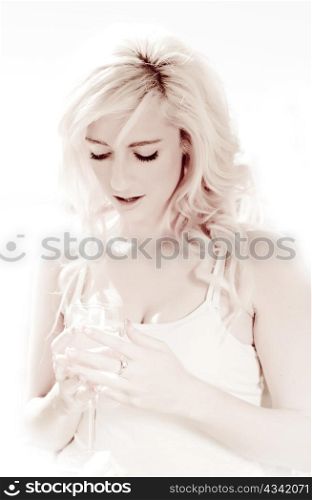 high key young woman with glass of wine