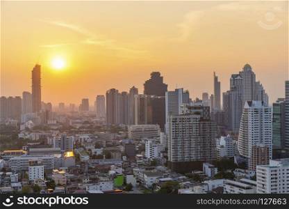 High modern building in business city center of Bangkok at sunset. Travel to Thailand.