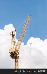 High modern carne with the white cloud in the construction site.