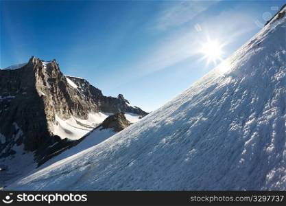 High mountain landscape at sunrise; Gran Paradiso massif (4046 mt), Italy, Europe.