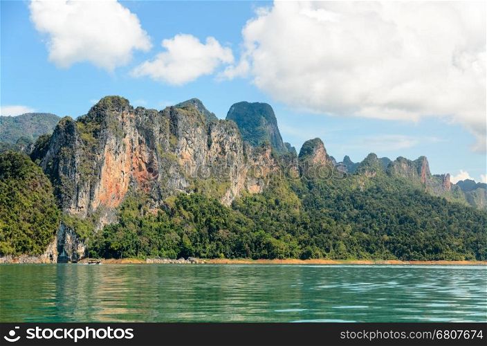 High mountain range above the green lake at Ratchapapha dam in Khao Sok National Park, Surat Thani province, Guilin of Thailand.