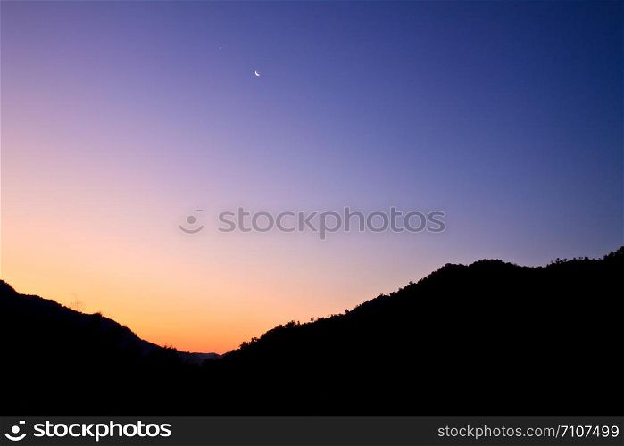 high mountain silhouette with beautiful colorful sky.