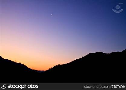 high mountain silhouette with beautiful colorful sky.