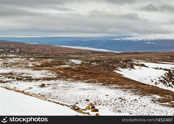 High panoramic view of the Lagarfljot river and mountains in a winter day, Iceland. Lagarfljot river and mountains