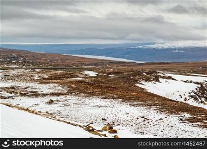 High panoramic view of the Lagarfljot river and mountains in a winter day, Iceland. Lagarfljot river and mountains