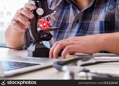 High precision engineering with man working with microscope