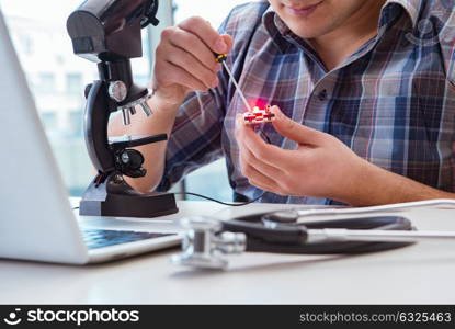 High precision engineering with man working with microscope