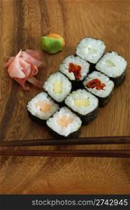 high quality photo of sushi meal (hossomaki salmon) and chopsticks