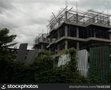 High-rise construction site with protective barriers in Thailand