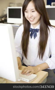 High school girl operating a PC