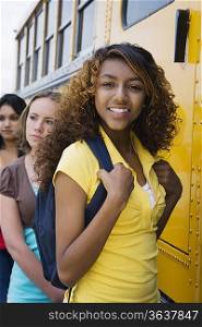 High School Girls Getting On School Bus