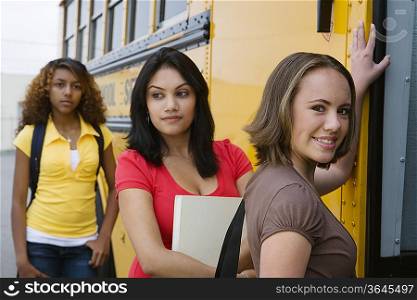 High School Girls Getting On School Bus
