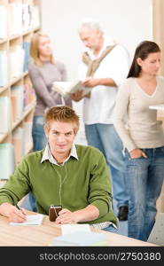 High school library - student with headphones listen to music