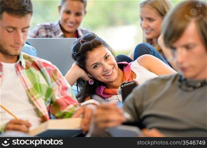 High-school pupils in study room music books smiling teens college