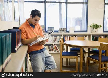 High School Student Studying in Library