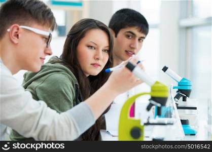 High School students. Group of students working together at laboratory class.
