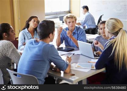 High School Students In Class Using Laptops