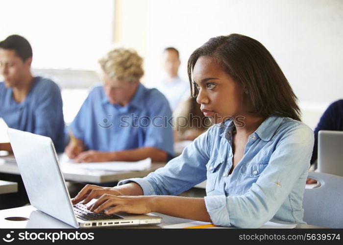 High School Students In Class Using Laptops