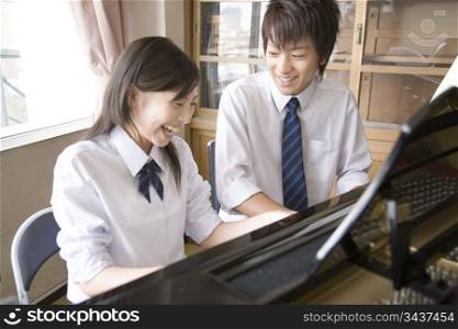 High school students playing the piano