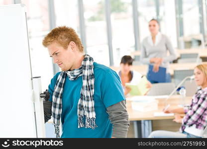 High school students with professor in classroom studying