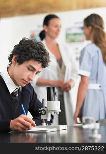 High School Students With Teacher in Chemistry Class