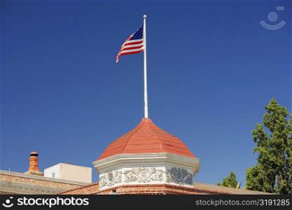 High section view of a building with an American flag on the top of it