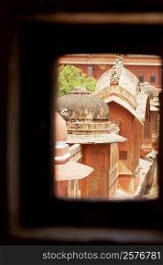 High section view of domes of a palace seen through a window, City Palace, Jaipur, Rajasthan, India