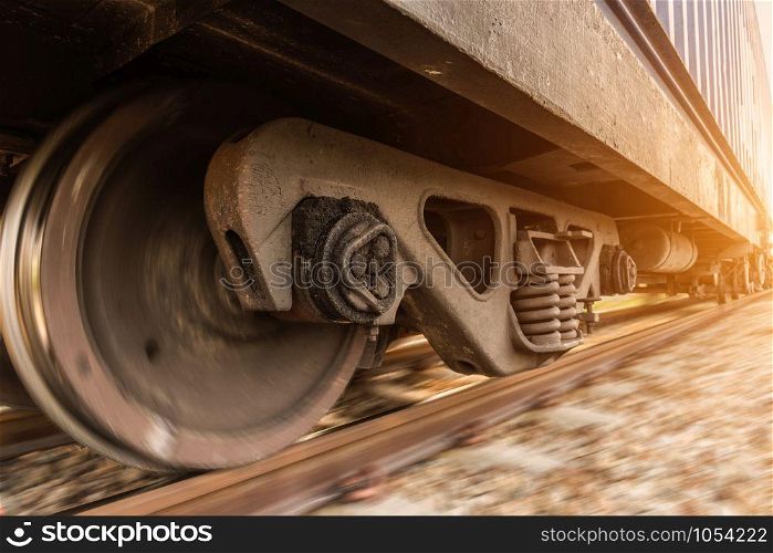 High speed diesel train on tracks with motion blur at sunset