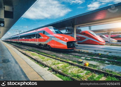 High speed trains on the train station at sunset Venice, Italy. Beautiful modern intercity passenger trains on the railway platform. Railroad in Europe. Railway station. Passenger transportation