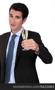 high-spirited businessman drinking a toast