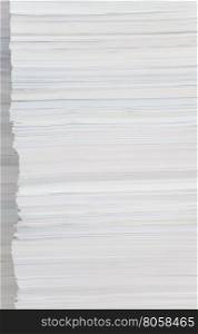 High stack of paper close-up as background