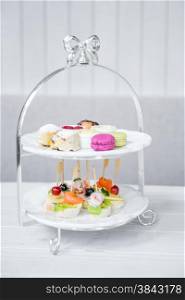 High Tea set with macaroons and Seafood cocktail